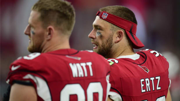 Oct 24, 2021; Glendale, Arizona, USA; Arizona Cardinals defensive end J.J. Watt (99) and Arizona Cardinals tight end Zach Ertz (86) look on against the Houston Texans during the second half at State Farm Stadium. Mandatory Credit: Joe Camporeale-USA TODAY Sports  